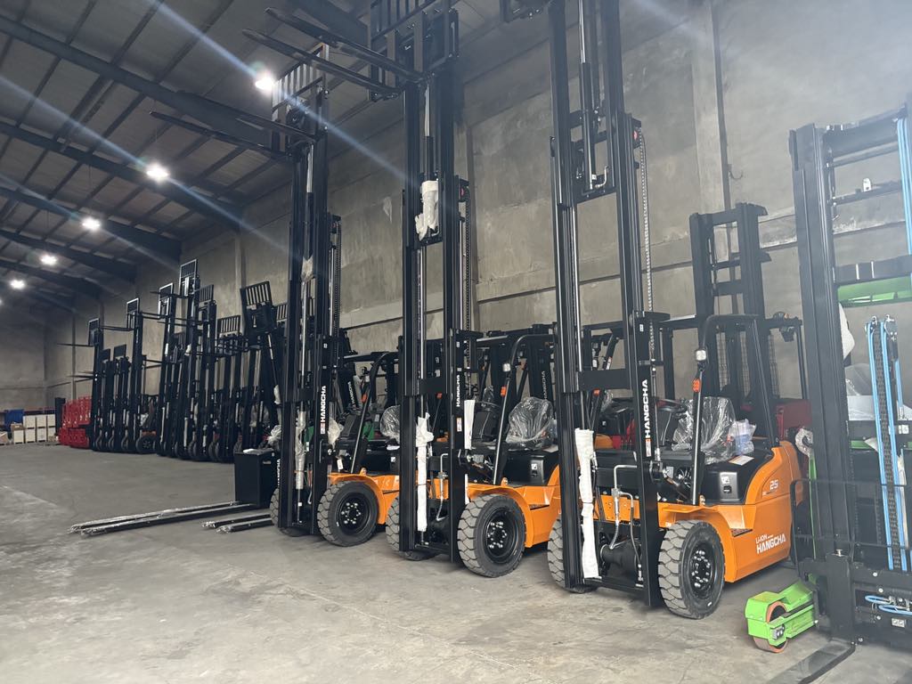 Technician servicing a forklift